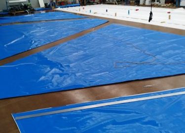 Custom shaped thermal concrete blankets on a manufacturing floor