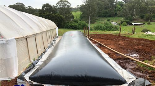 Water storage tanks for greenhouses water storage bladder tank installed next to a greenhouse