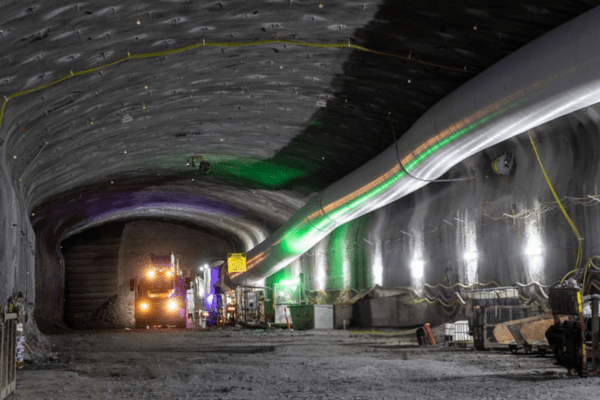 Large underground tunnel under construction with ventilation control systems in place