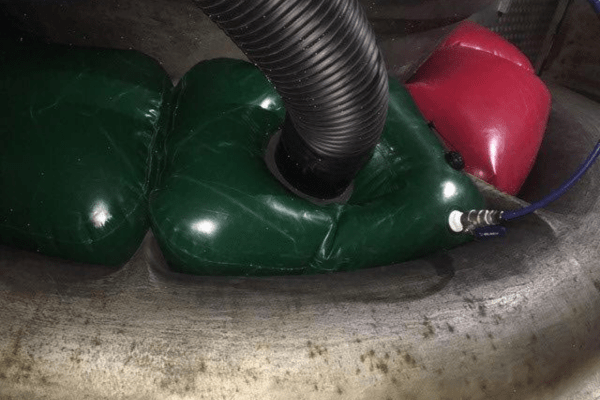 Inflatable duct plug positioned for turbine maintenance at LNG plant