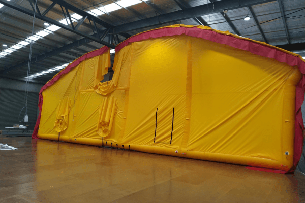 Inflatable brattice walls undergoing quality control testing