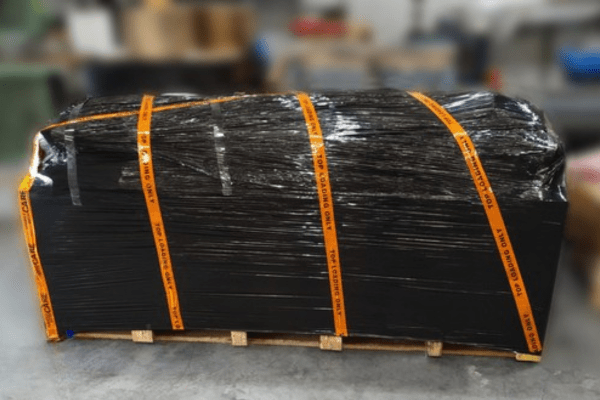 Flexible dust suppression water storage bladder is packed for transportation to a site 